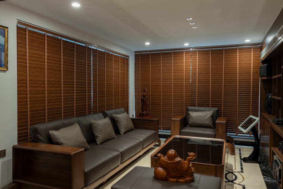Modern living room featuring custom roller shades and elegant interior design